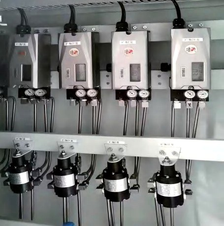 TOP-5879F1 positioners lined up on the production test bench